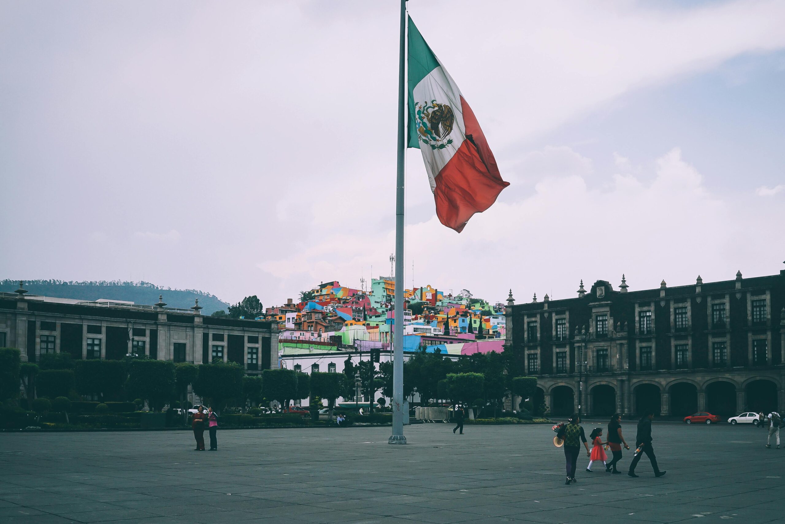 People Near Mexican Flag